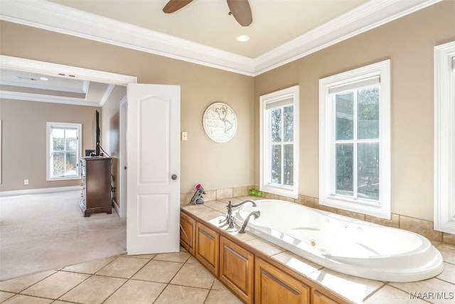 bathroom with a bathing tub, ceiling fan, crown molding, and tile patterned floors