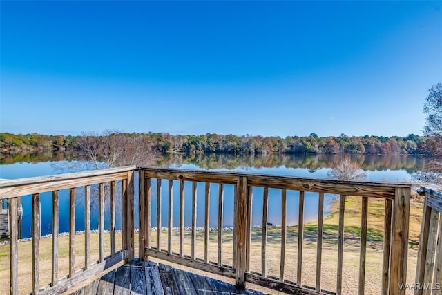 wooden deck featuring a water view