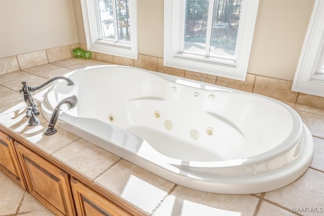 bathroom featuring a washtub and tile patterned floors