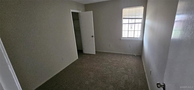 unfurnished bedroom with carpet floors