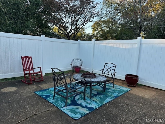 view of patio with an outdoor fire pit