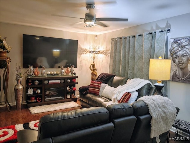 living room featuring dark hardwood / wood-style floors and ceiling fan