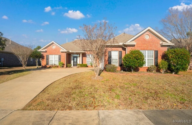 ranch-style house with a front lawn