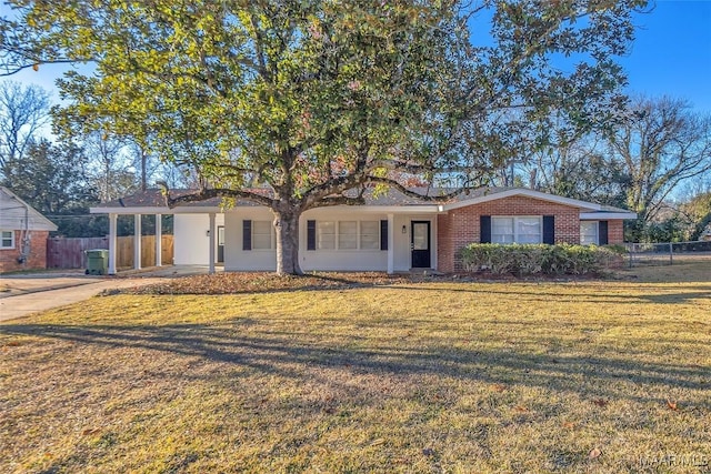 view of front of home with a front lawn and a carport