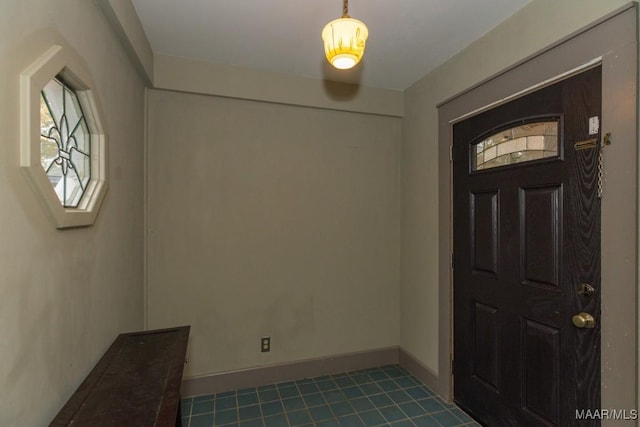 1220 Westmoreland Ave, Montgomery, AL 36106 - foyer entrance with dark tile patterned flooring and baseboards