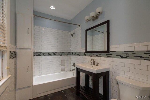 1220 Westmoreland Ave, Montgomery, AL 36106 - full bathroom with tile walls, tile patterned flooring, shower / tub combination, and vanity