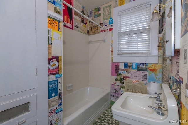 bathroom featuring  shower combination and sink