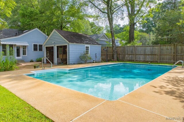 1220 Westmoreland Ave, Montgomery, AL 36106 - view of swimming pool featuring an outdoor structure and a patio area