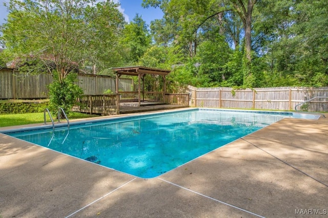 1220 Westmoreland Ave, Montgomery, AL 36106 - view of swimming pool featuring a fenced backyard, a deck, and a patio
