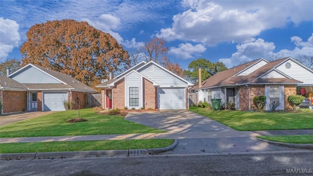 view of front of home featuring a front yard and a garage