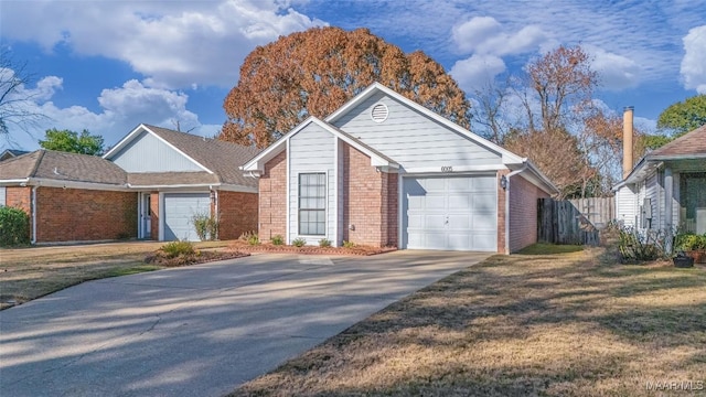 view of front facade with a front lawn and a garage