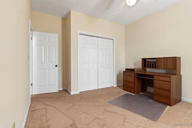 carpeted office with ceiling fan