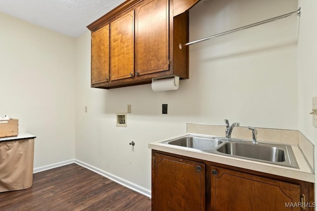 kitchen with a textured ceiling, sink, and dark hardwood / wood-style floors