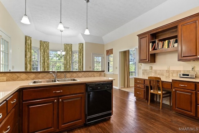 kitchen with black dishwasher, tasteful backsplash, dark hardwood / wood-style floors, pendant lighting, and a textured ceiling