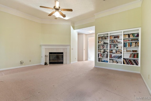 unfurnished living room with a fireplace, carpet flooring, ceiling fan, and crown molding