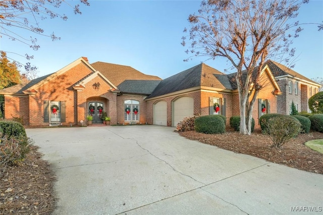 view of front of home featuring a garage and french doors