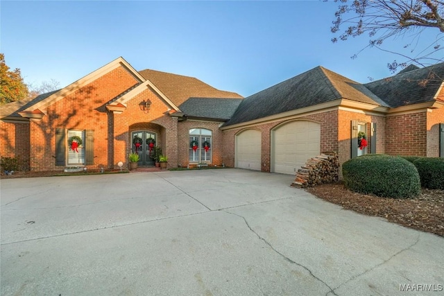 view of front of property with french doors and a garage