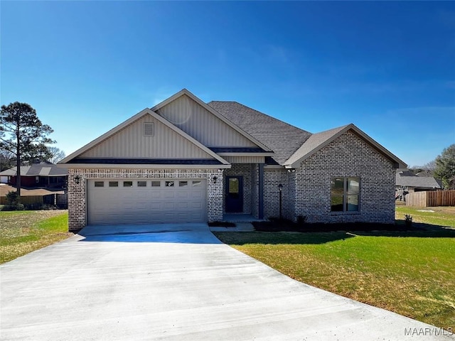 craftsman house featuring a front yard, brick siding, and driveway