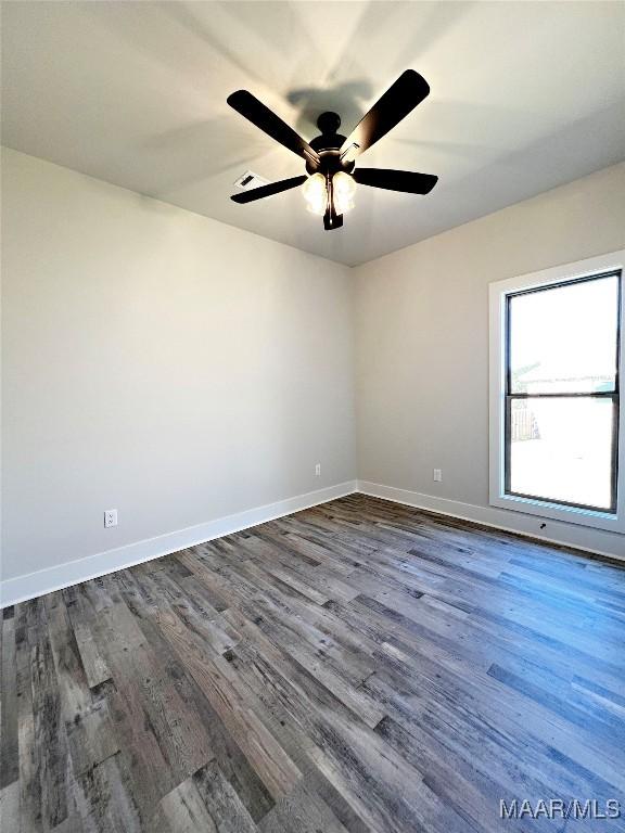 6 Village Knl, Wetumpka, AL 36093 - spare room featuring ceiling fan, baseboards, and dark wood-style floors