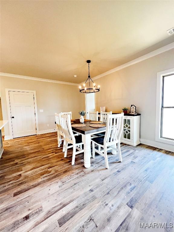 6 Village Knl, Wetumpka, AL 36093 - dining room featuring wood finished floors, baseboards, and ornamental molding