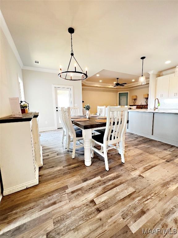 6 Village Knl, Wetumpka, AL 36093 - dining room featuring light wood finished floors, ceiling fan with notable chandelier, recessed lighting, and crown molding
