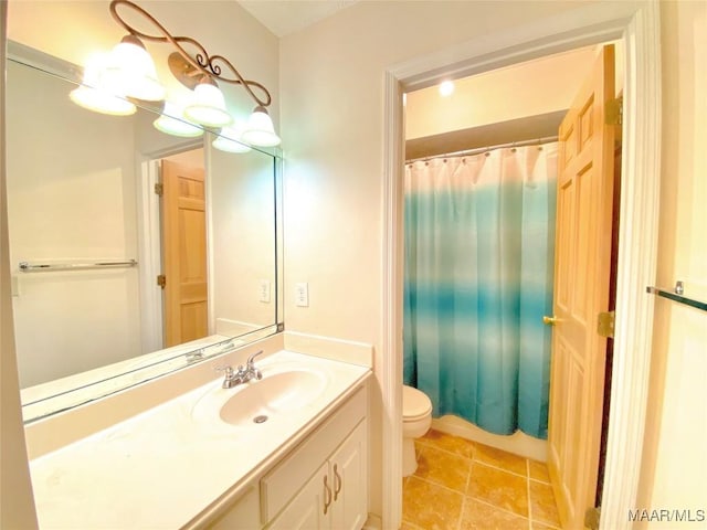 bathroom featuring tile patterned floors, vanity, and toilet