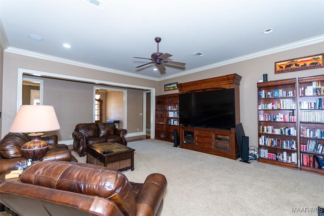 living room with ceiling fan, light colored carpet, and ornamental molding