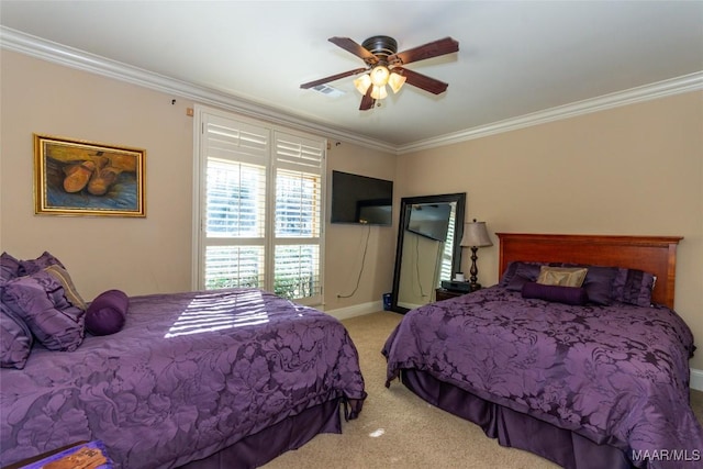 carpeted bedroom featuring ceiling fan and crown molding