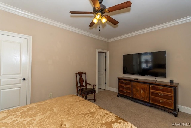 carpeted bedroom featuring ceiling fan and crown molding