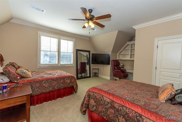 carpeted bedroom with vaulted ceiling, ceiling fan, and ornamental molding