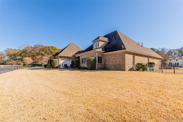 view of side of home with a garage