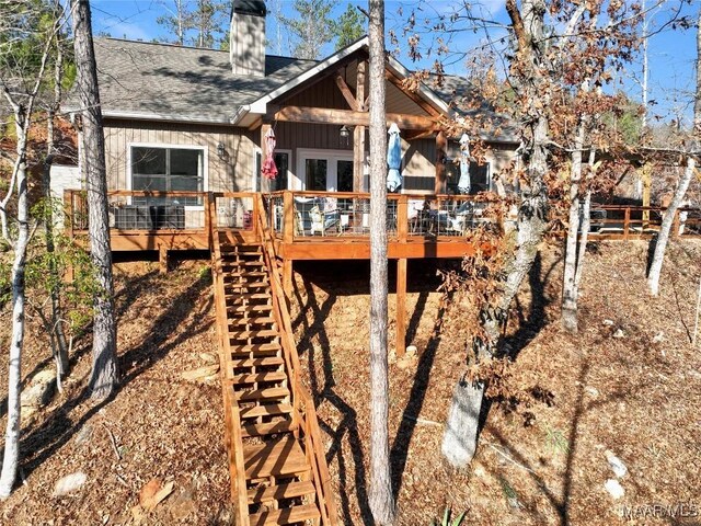 rear view of house featuring a deck