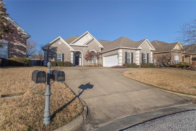 view of front of house featuring a front yard and a garage