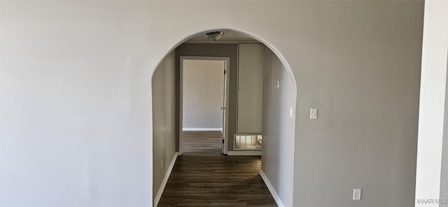 corridor featuring dark hardwood / wood-style floors