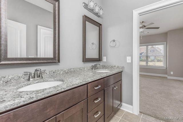 bathroom with ceiling fan, tile patterned flooring, and vanity