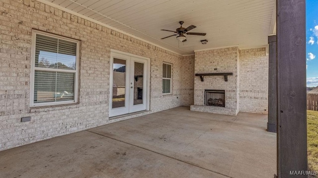 view of patio with french doors, an outdoor brick fireplace, and ceiling fan