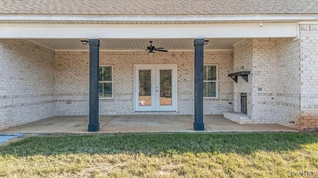 view of exterior entry with french doors, a patio, and ceiling fan