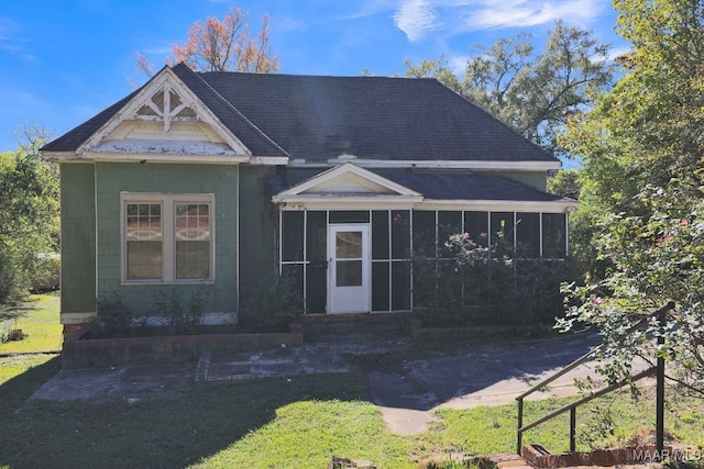 view of front facade with a sunroom