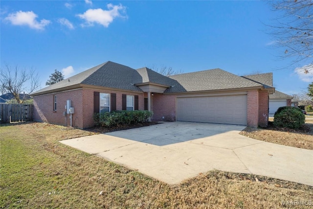 view of front of property with a front yard and a garage