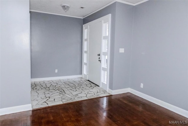 entryway featuring wood-type flooring and ornamental molding