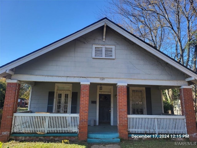 bungalow-style home featuring covered porch