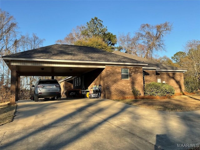 view of side of property featuring a carport