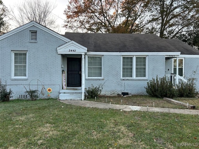 view of front of home with a front yard