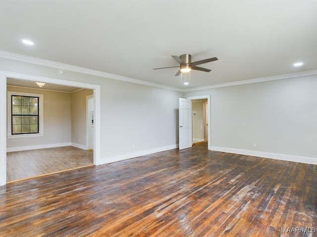 spare room featuring ornamental molding, ceiling fan, and dark wood-type flooring