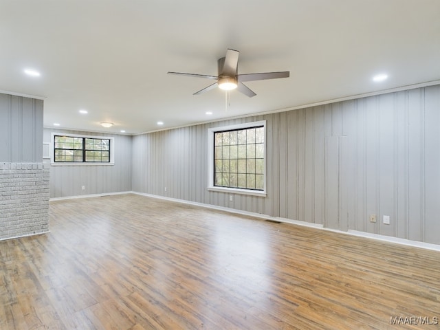 unfurnished room featuring ceiling fan and light hardwood / wood-style floors