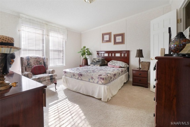 carpeted bedroom with ornamental molding