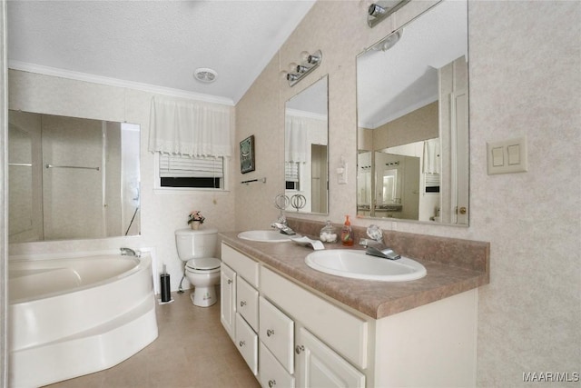 bathroom with toilet, crown molding, a textured ceiling, and a tub