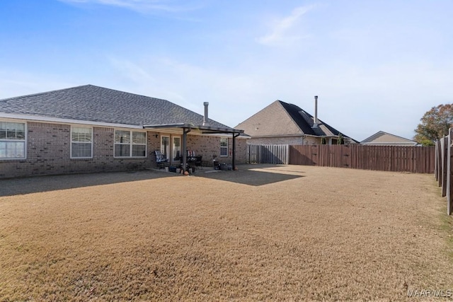 rear view of house with a patio