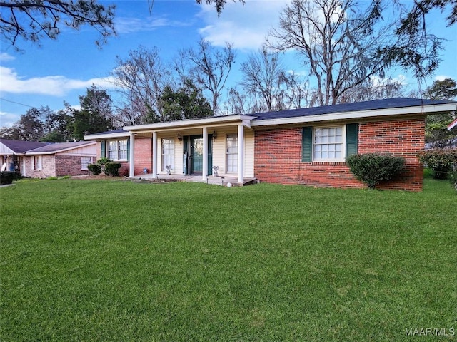 ranch-style home with a front lawn