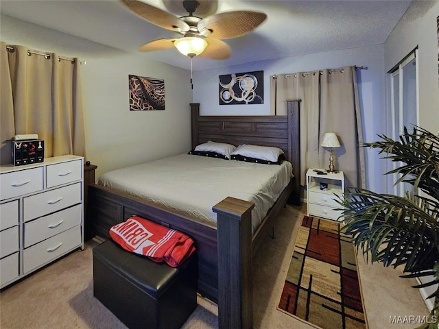 bedroom featuring ceiling fan and light colored carpet